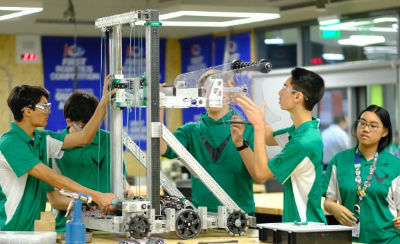 FIRST Robotics participants building a robot